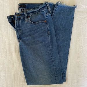 9” high-rise toothpick denim in indigo wash with cut hems
